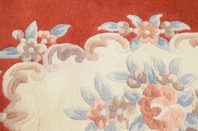 Lot 526 - Chinese claret ground wool rug