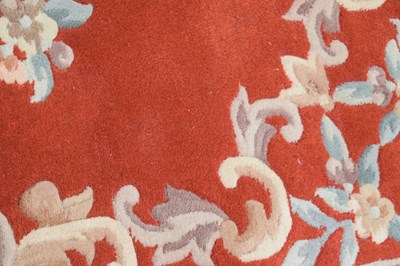 Lot 526 - Chinese claret ground wool rug
