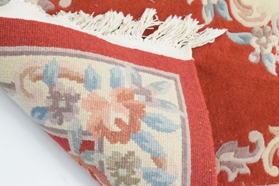 Lot 526 - Chinese claret ground wool rug