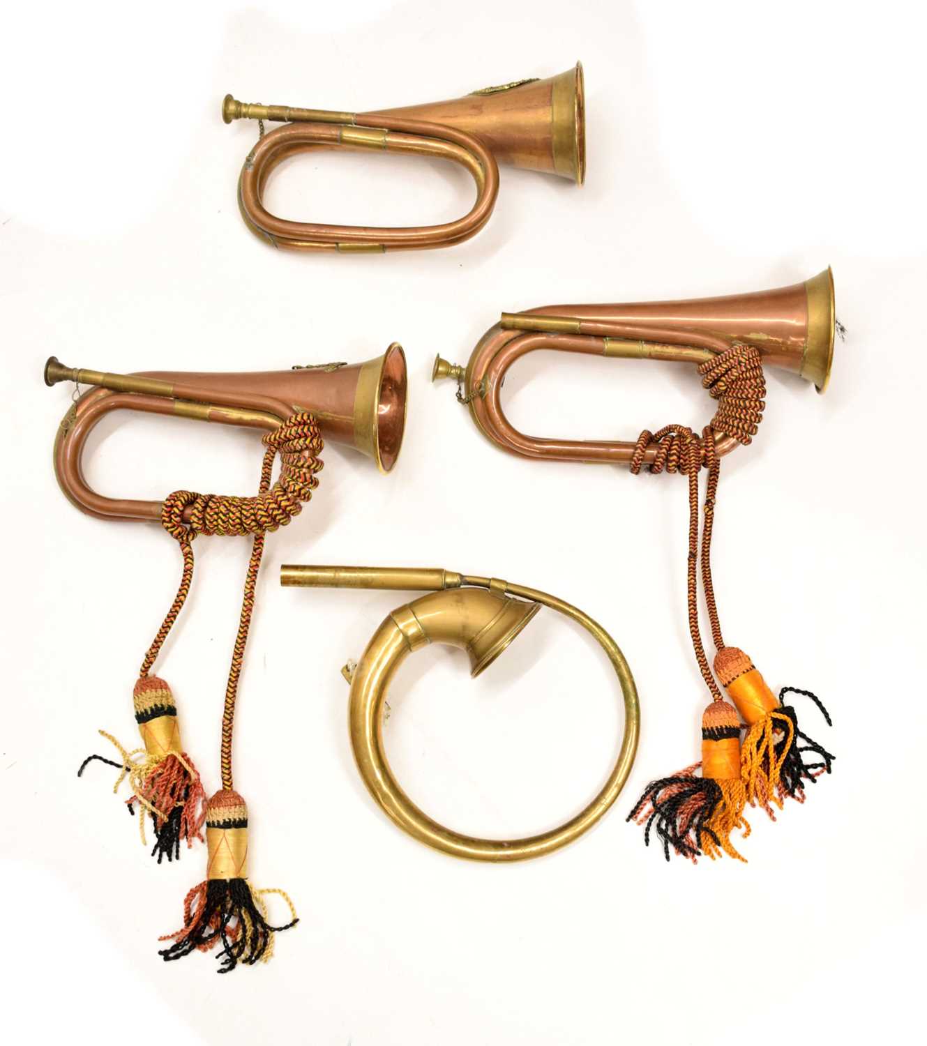 Lot 494 - Three copper and brass military bugles