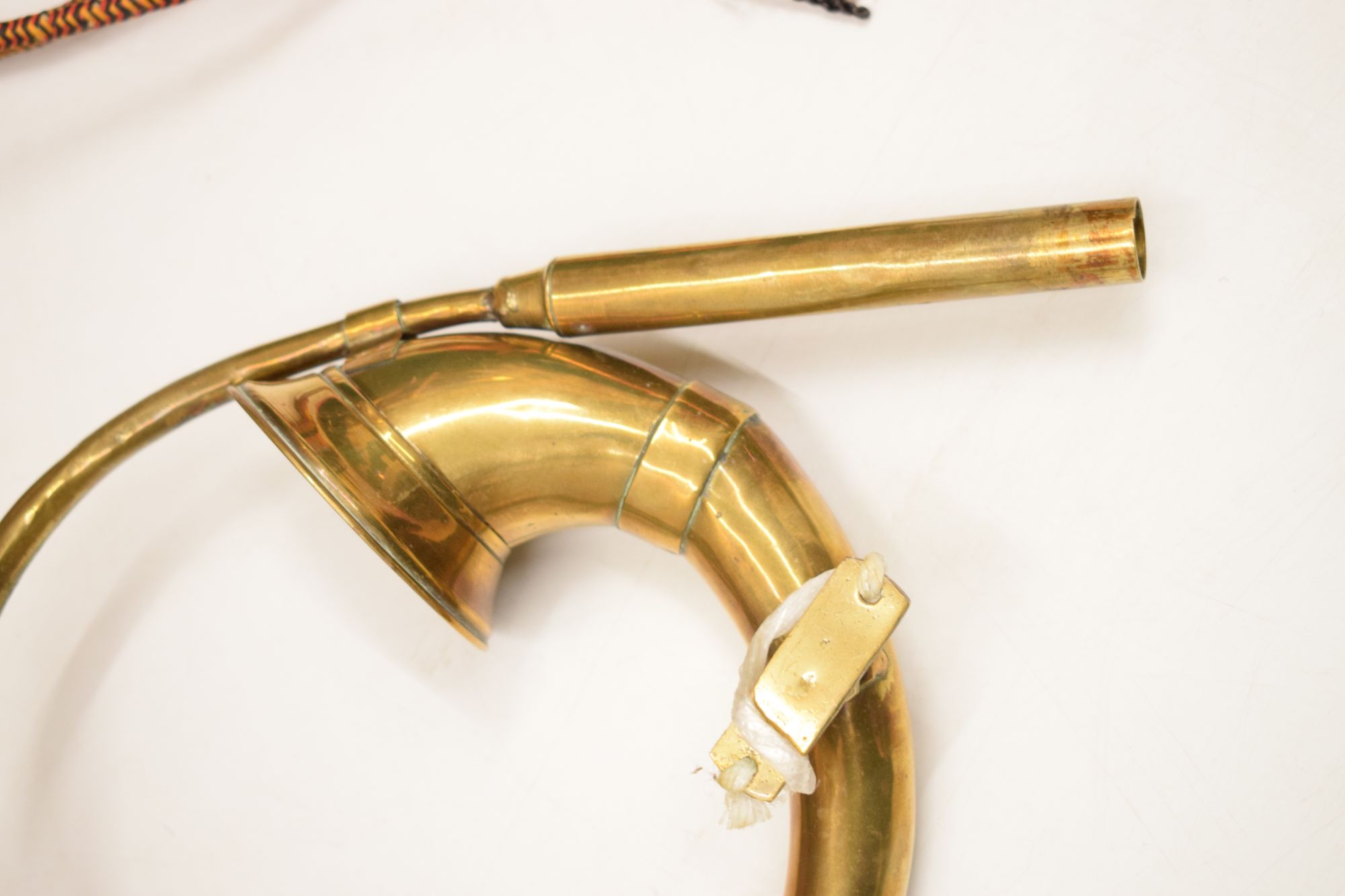 Lot 494 Three copper and brass military bugles