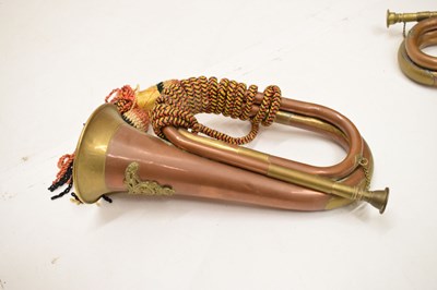 Lot 494 - Three copper and brass military bugles