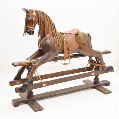 Lot 413 - Good quality carved wooden rocking horse