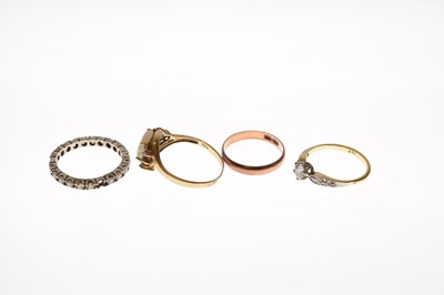 Lot 36 - Three assorted yellow metal rings and one other