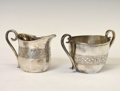 Lot 252 - Middle Eastern white-metal jug and sugar basin