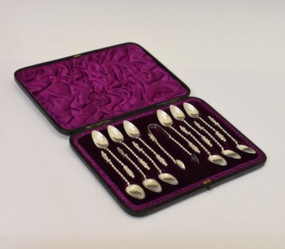 Lot 235 - Victorian set of twelve apostle teaspoons and tongs