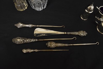 Lot 143 - Quantity of silver capped dressing requisites, silver handled button hooks, etc