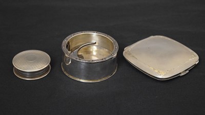 Lot 144 - George V silver pill box, a silver compact, and a white-metal circular stand