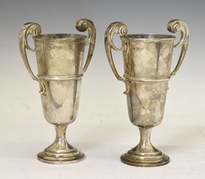 Lot 205 - Pair of Edward VII silver twin-handled footed vases