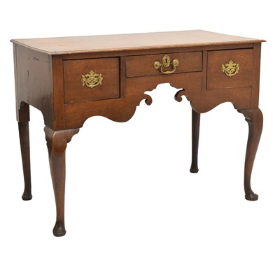 Lot 714 - George III oak three-drawer lowboy