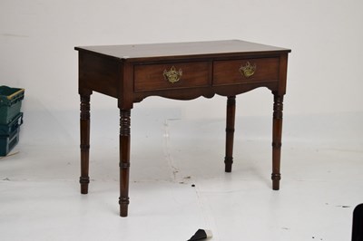 Lot 690 - Mahogany two-drawer side table