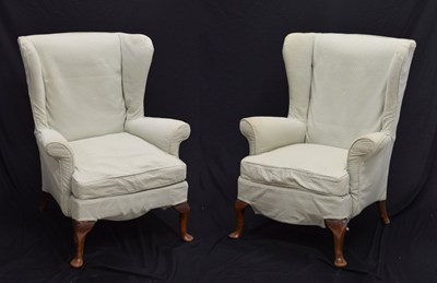 Lot 698 - Pair of loose covered wing armchairs