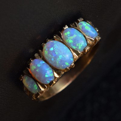 Lot 15 - 9ct gold five-stone opal ring