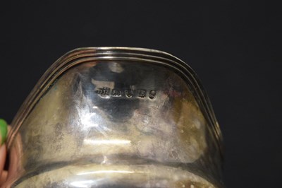 Lot 145 - Georgian silver cream jug and muffner