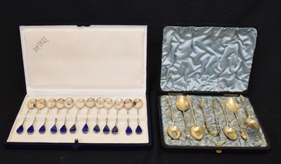 Lot 132 - Set of six teaspoons and sugar tongs, and set of twelve white metal and blue-stone teaspoons