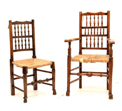 Lot 433 - Two rush-seated spindle-back chairs