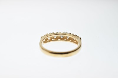 Lot 18 - 9ct gold and seven stone diamond ring