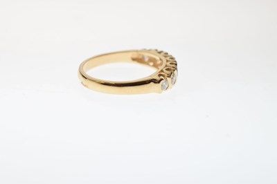 Lot 18 - 9ct gold and seven stone diamond ring