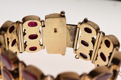 Lot 40 - Silver-gilt bracelet of three rows of oval faceted rubies