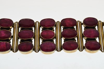 Lot 40 - Silver-gilt bracelet of three rows of oval faceted rubies
