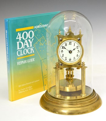 Lot 467 - Anniversary clock under glass dome and repair guide