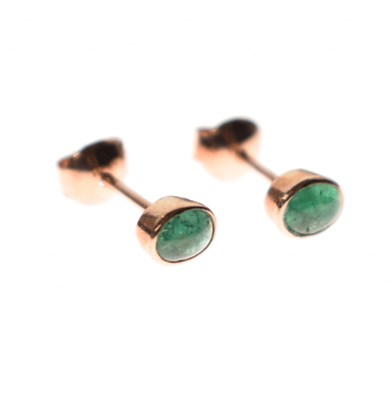Lot 77 - Pair of emerald cabochon rose gold ear studs
