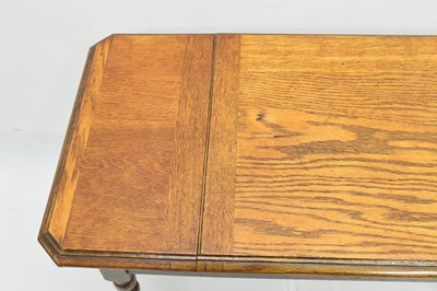 Lot 504 - Early 20th century Britisher oak metamorphic writing table/desk