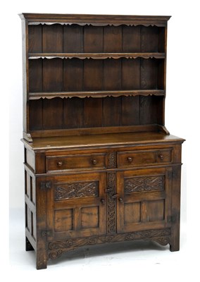 Lot 495 - 20th century carved oak high dresser