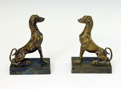 Lot 226 - Pair of bronze figures of seated hounds