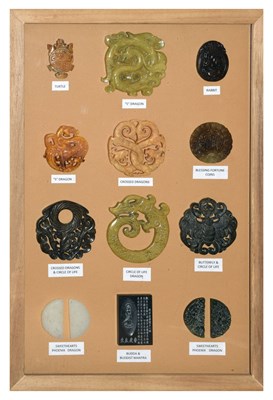 Lot 189 - Framed group of twelve Chinese carvings, some hardstone including; 'Circle of Life Dragon', etc