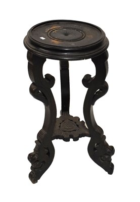 Lot 584 - Ebonised vase stand