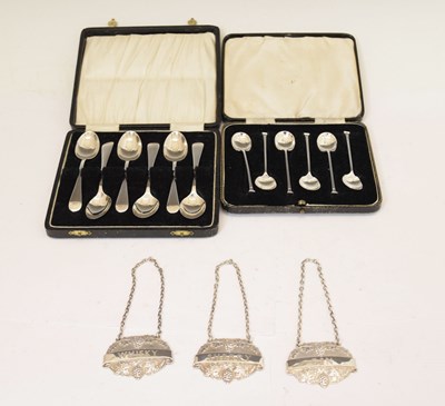 Lot 128 - Two cased sets of silver teaspoons/coffee spoons, and a set of three decanter labels