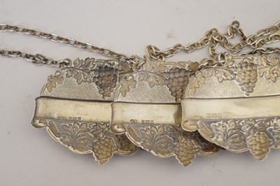 Lot 128 - Two cased sets of silver teaspoons/coffee spoons, and a set of three decanter labels