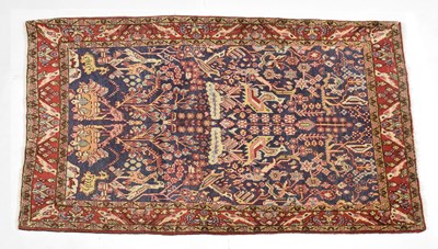 Lot 527 - Blue and red ground wool rug