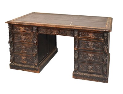 Lot 591 - Carved oak twin pedestal desk