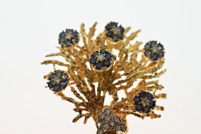 Lot 22 - Diamond and sapphire 18ct yellow and white gold set floral spray brooch