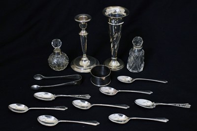 Lot 135 - Quantity of silver items to include bud vase, candlestick, teaspoons, etc