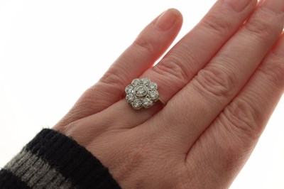 Lot 10 - Diamond nine stone daisy cluster ring