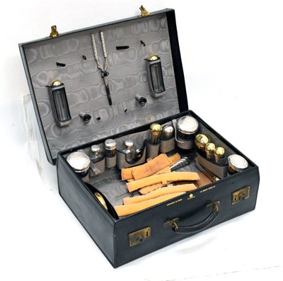 Lot 117 - Morocco vanity case retailed by Edwards & Sons, containing silver-capped jars