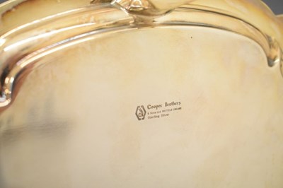 Lot 108 - Elizabeth II silver salver with lobbed and readed edge standing on three cast feet