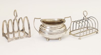 Lot 126 - Two silver toast racks and a George V silver sugar basin