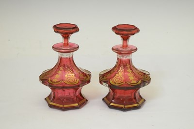 Lot 287 - Pair of cranberry glass perfume bottles