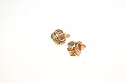 Lot 38 - Pair of 14ct gold tri-colour knot ear studs, 4g approx. .