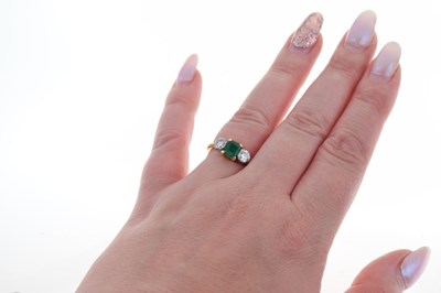 Lot 16 - Diamond and emerald three stone 18ct gold ring