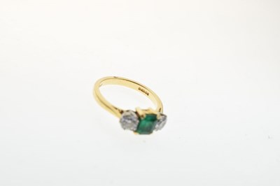 Lot 16 - Diamond and emerald three stone 18ct gold ring