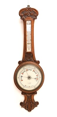 Lot 516 - Early 20th century carved oak aneroid barometer and thermometer