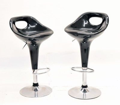 Lot 506 - Pair of black retro style chrome based bar stools