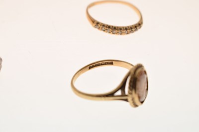 Lot 23 - Four 9ct gold rings, and another