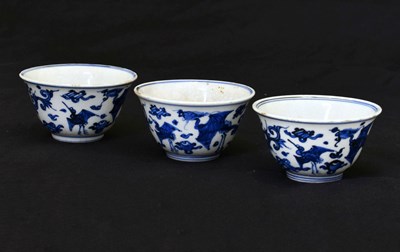 Lot 228 - Three Chinese blue and white porcelain tea bowls