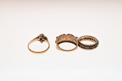 Lot 30 - Two 9ct gold dress rings each set garnet-coloured stones